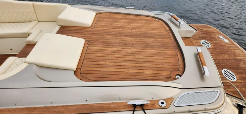 Slide: The Image of 2017 Chris-Craft Corsair 32 boat with teak deck and cream seating. - 14