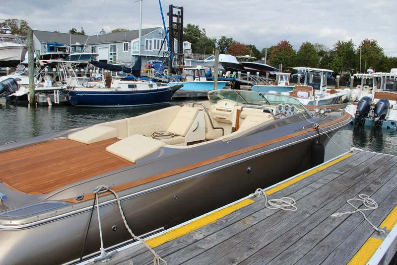 Slide: The Image of 2017 Chris-Craft Corsair 32 luxury boat docked at marina. - 18