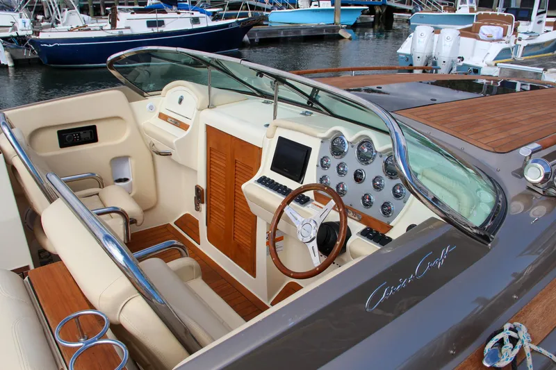 Slide: The Image of 2017 Chris-Craft Corsair 32 boat interior with elegant dashboard and seating. - 19