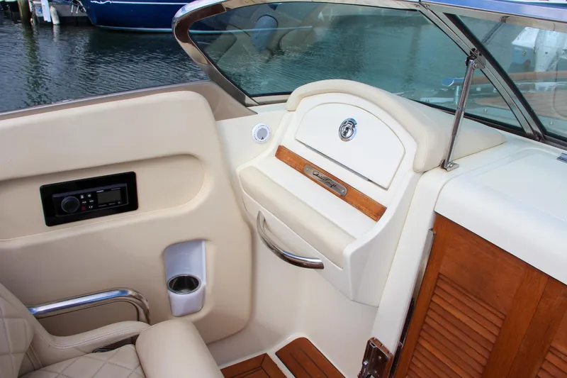 Slide: The Image of 2017 Chris-Craft Corsair 32 interior with elegant seating and wood accents. - 24