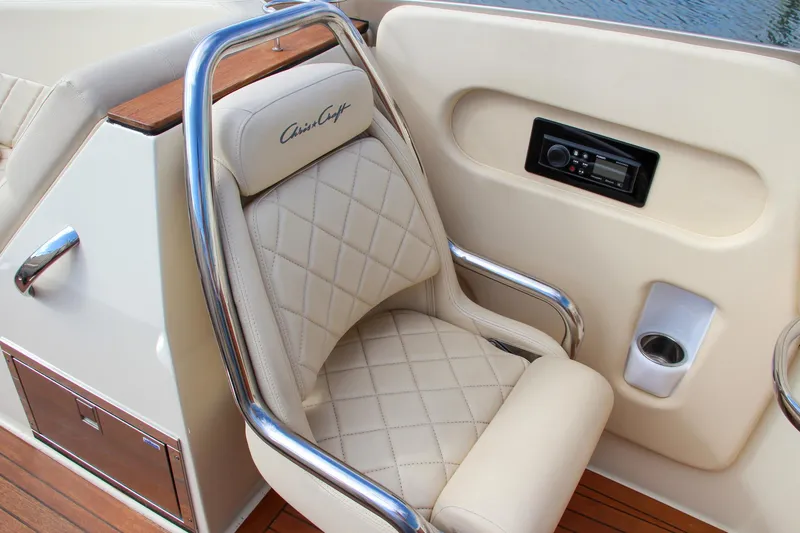 Slide: The Image of Luxurious 2017 Chris-Craft Corsair 32 boat seat with quilted leather and chrome accents. - 25
