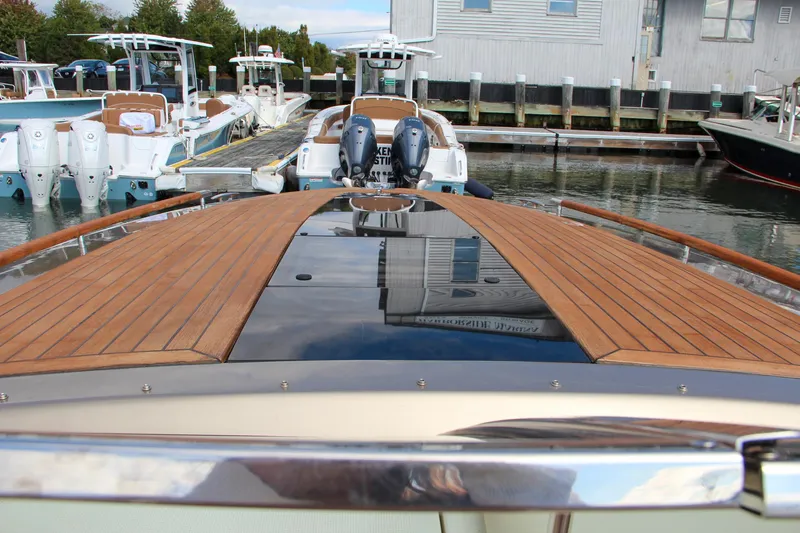 Slide: The Image of 2017 Chris-Craft Corsair 32 with teak deck, docked at marina. - 26