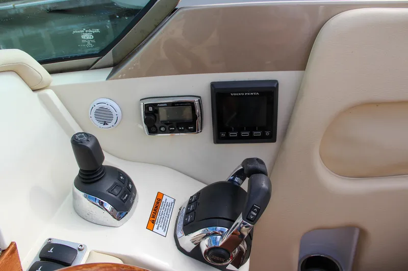 Slide: The Image of 2017 Chris-Craft Corsair 32 boat controls with joystick and display panel. - 28