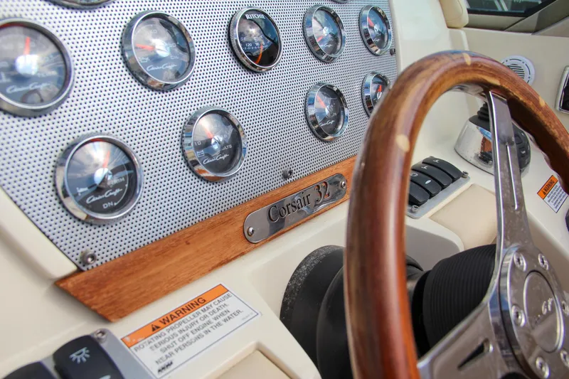 Slide: The Image of Dashboard of 2017 Chris-Craft Corsair 32 with wooden steering wheel and gauges. - 30