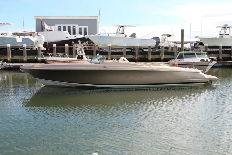 Slide: The Image of 2017 Chris-Craft Corsair 32 boat docked in marina, side view. - 44