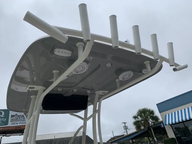 Slide: The Image of 2025 Pioneer SPORTFISH 222 boat roof with rod holders and speakers. - 15