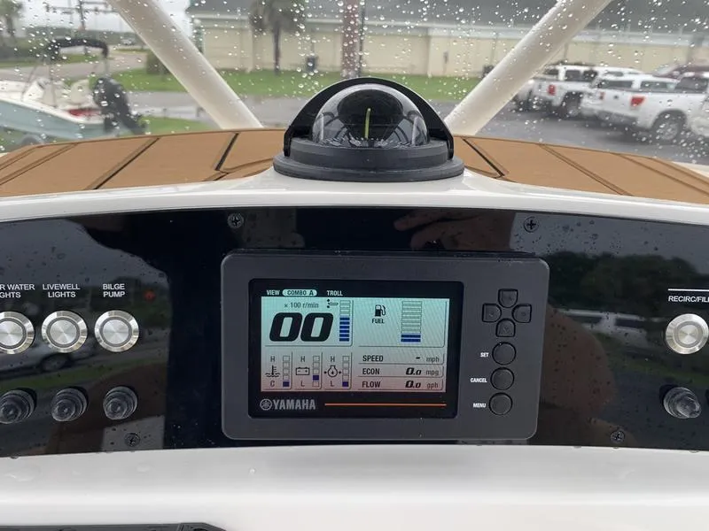 Slide: The Image of Yamaha display on 2025 Pioneer SPORTFISH 222 boat dashboard with controls. - 18