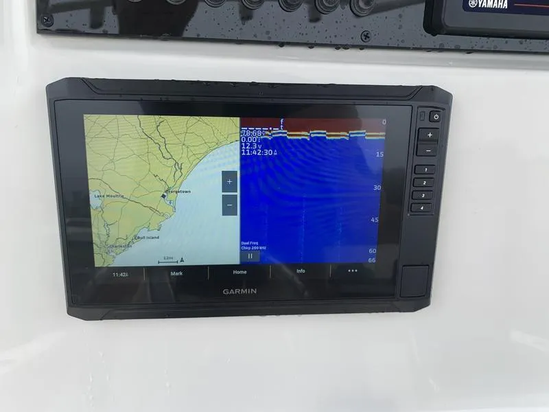 Slide: The Image of Garmin navigation display on 2025 Pioneer SPORTFISH 222 boat, showing map and sonar data. - 19