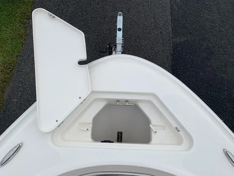 Slide: The Image of Open storage compartment on 2025 Pioneer SPORTFISH 222 boat deck. - 29