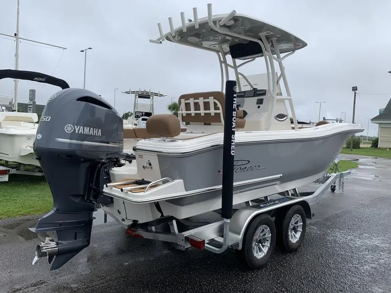 Slide: The Image of 2025 Pioneer SPORTFISH 222 boat with Yamaha engine on trailer, parked outdoors. - 3