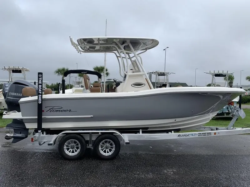 Slide: The Image of 2025 Pioneer SPORTFISH 222 boat on trailer, gray hull, overcast day. - 4