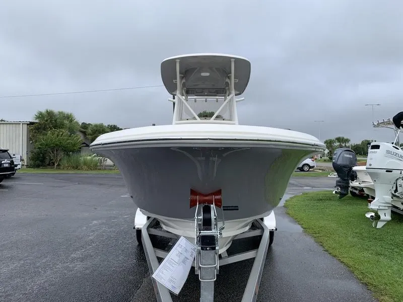 Slide: The Image of 2025 Pioneer SPORTFISH 222 boat on trailer, front view, overcast day. - 6