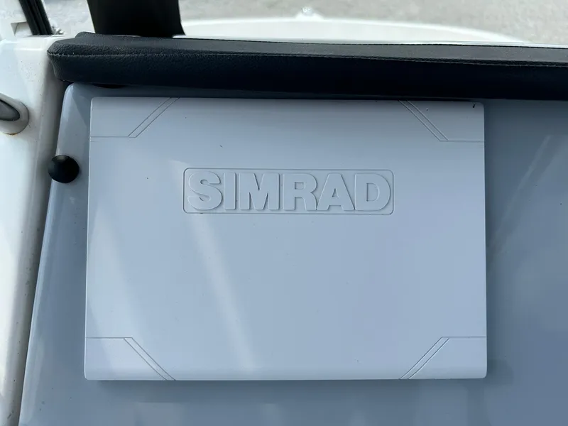 Slide: The Image of Simrad device on 2022 Bayliner Trophy T20CX boat dashboard. - 13