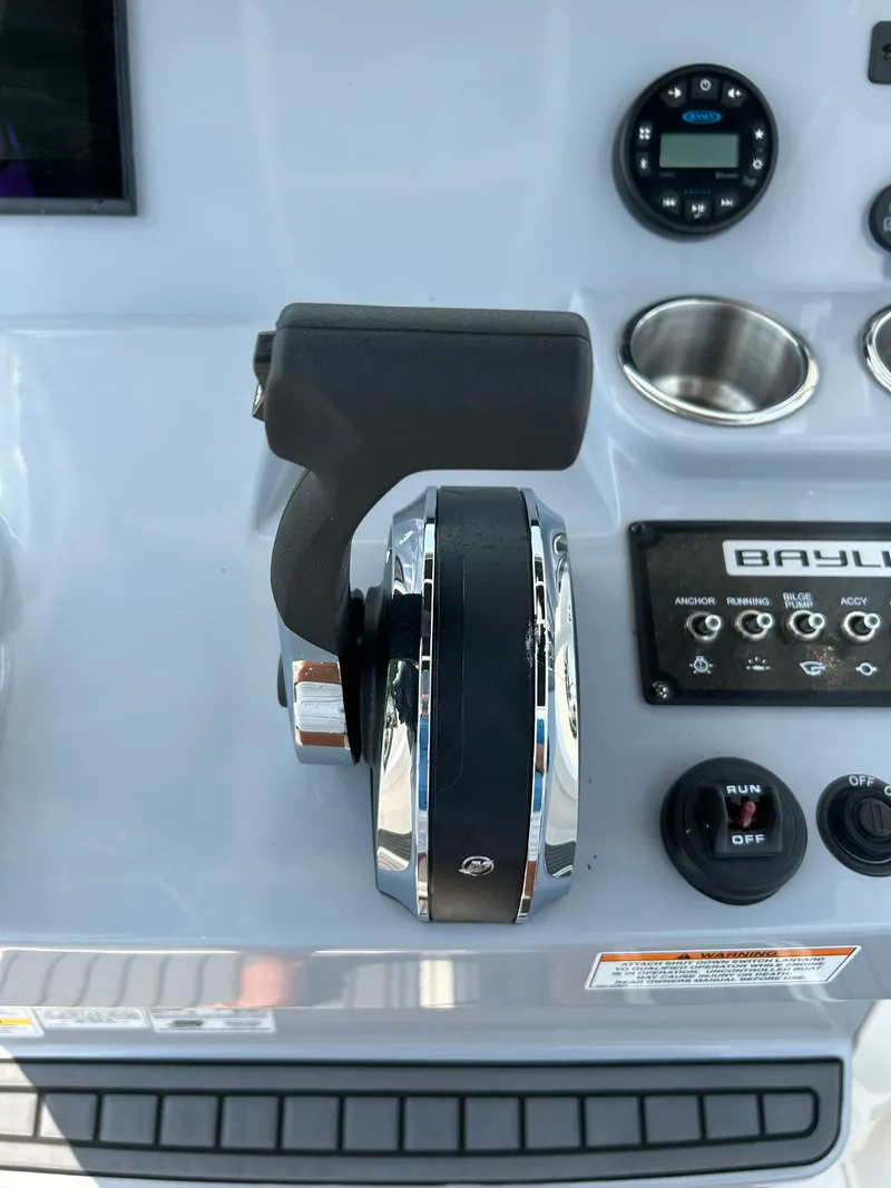 Slide: The Image of 2022 Bayliner Trophy T20CX boat control panel with throttle and gauges. - 14