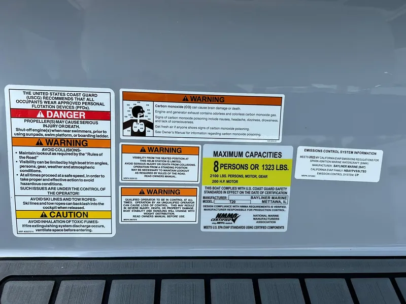 Slide: The Image of Warning labels on 2022 Bayliner Trophy T20CX, maximum capacity 8 persons or 1323 lbs. - 17
