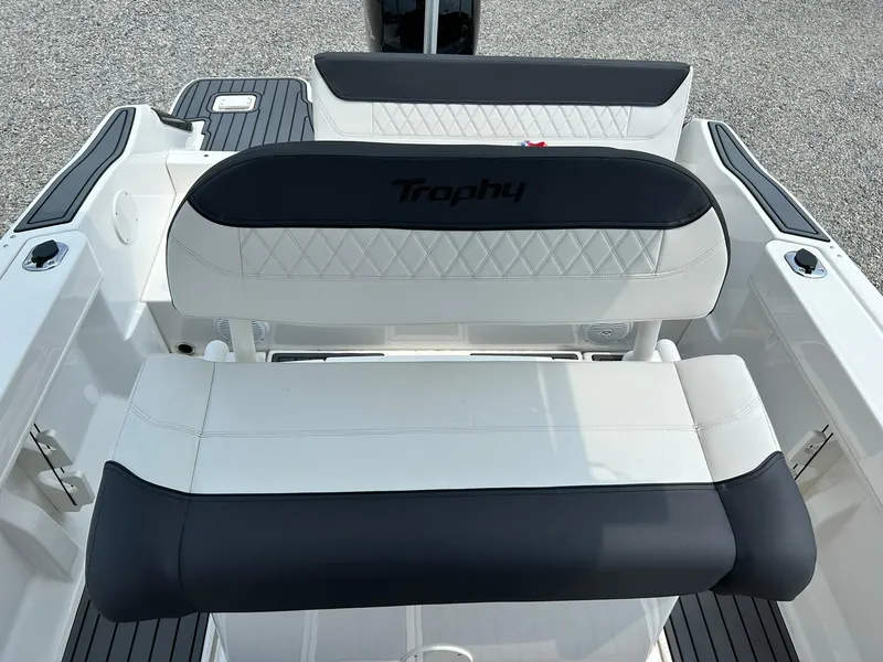 Slide: The Image of 2022 Bayliner Trophy T20CX boat seating with black and white upholstery. - 20