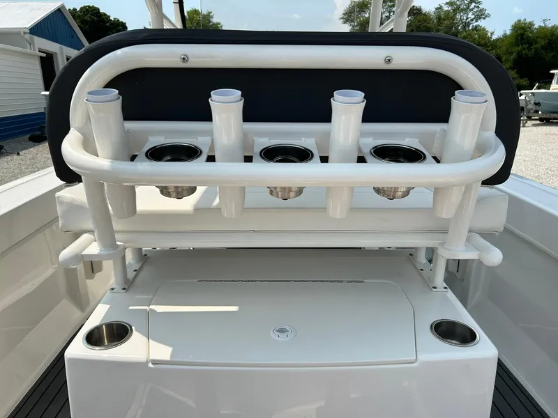 Slide: The Image of 2022 Bayliner Trophy T20CX boat with rod holders and storage compartment. - 21