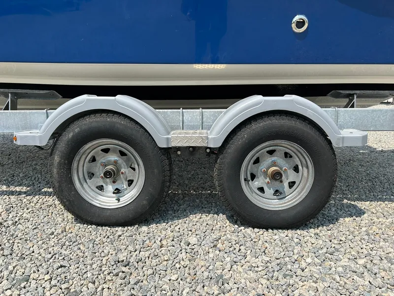 Slide: The Image of Trailer wheels of 2022 Bayliner Trophy T20CX on gravel surface. - 24