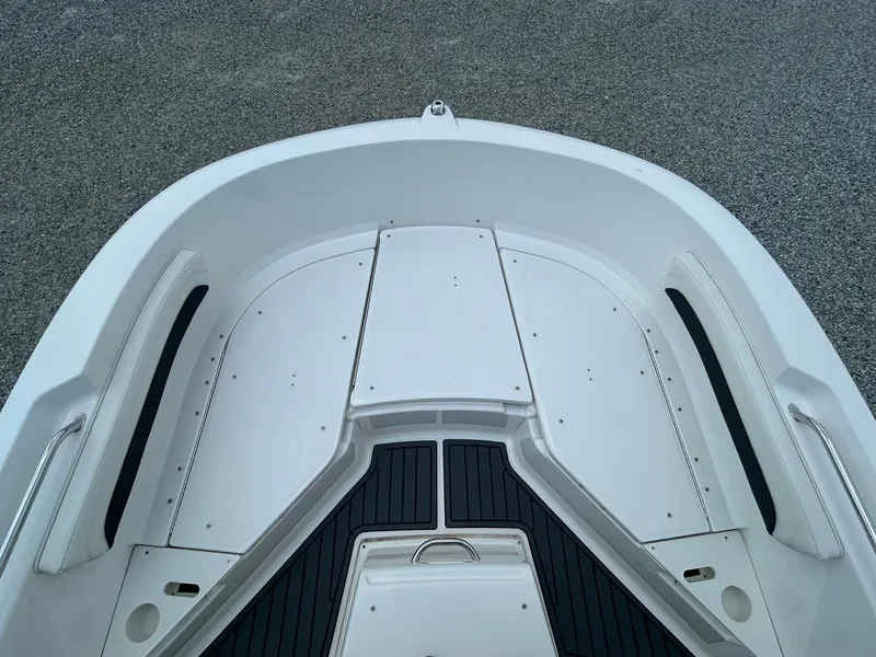 Slide: The Image of 2022 Bayliner Trophy T20CX boat deck, white with black accents, spacious and modern design. - 5