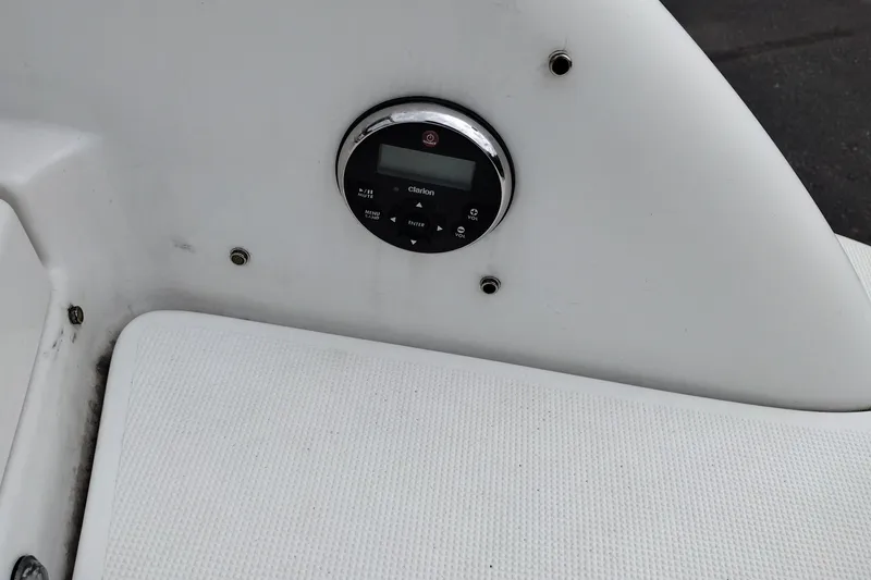 Slide: The Image of Clarion audio control panel on 2016 Formula 270 Bowrider boat interior. - 16