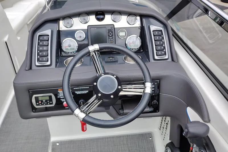 Slide: The Image of Steering console of a 2016 Formula 270 Bowrider boat with gauges and controls. - 17