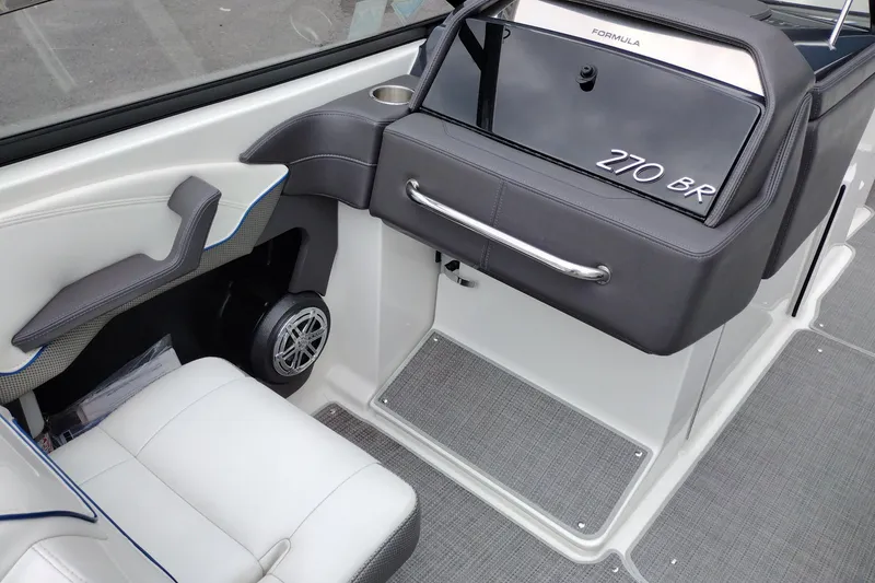 Slide: The Image of Interior of a 2016 Formula 270 Bowrider boat, featuring seating and storage. - 26