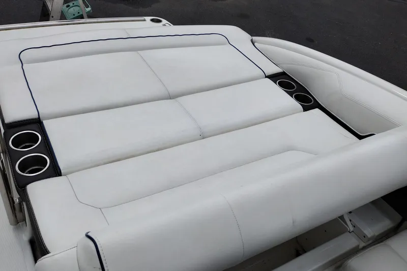 Slide: The Image of 2016 Formula 270 Bowrider boat seating with cup holders, featuring white upholstery. - 35