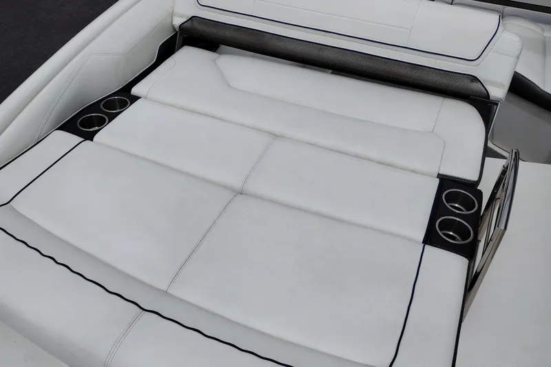 Slide: The Image of 2016 Formula 270 Bowrider boat interior with white cushioned seating and cup holders. - 36