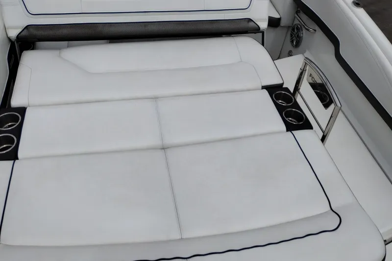 Slide: The Image of 2016 Formula 270 Bowrider boat interior with white cushioned seating and cup holders. - 37