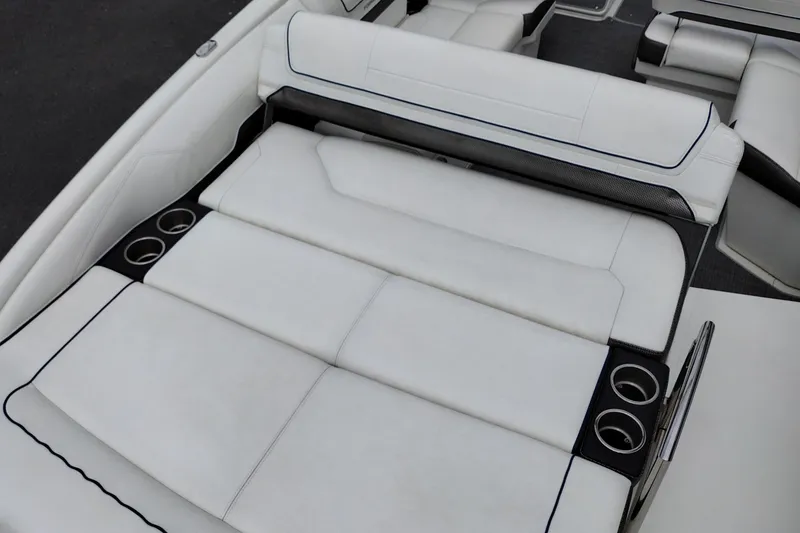 Slide: The Image of 2016 Formula 270 Bowrider boat interior with white cushioned seating and cup holders. - 38
