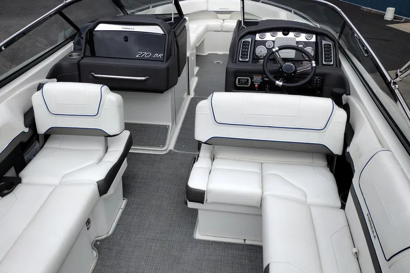 Slide: The Image of 2016 Formula 270 Bowrider interior with white seating and modern dashboard. - 41