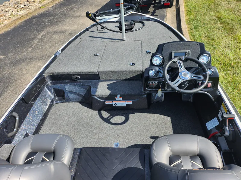 Slide: The Image of 2021 Nitro Z17 boat interior with steering wheel and seating. - 11