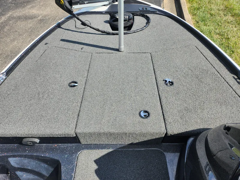 Slide: The Image of 2021 Nitro Z17 boat deck with gray carpet and storage compartments. - 14