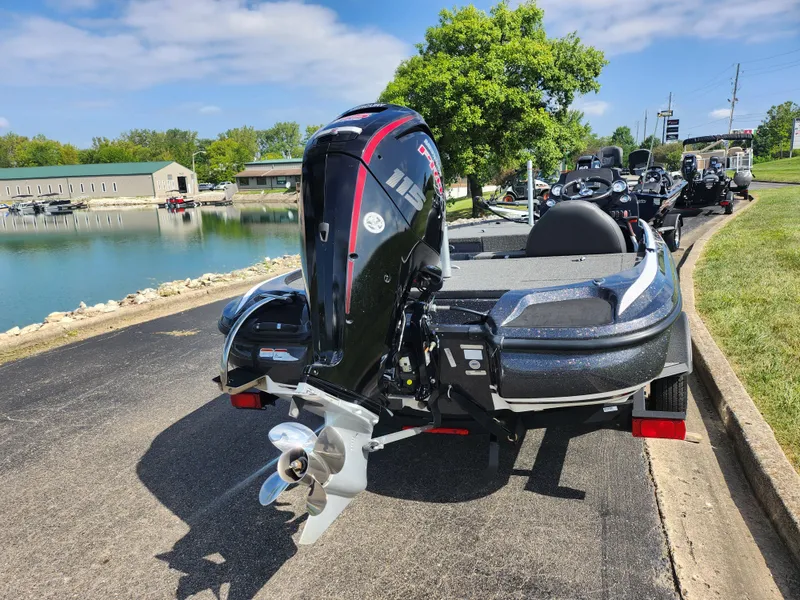 Slide: The Image of 2021 Nitro Z17 boat with powerful outboard motor by a scenic lake. - 2