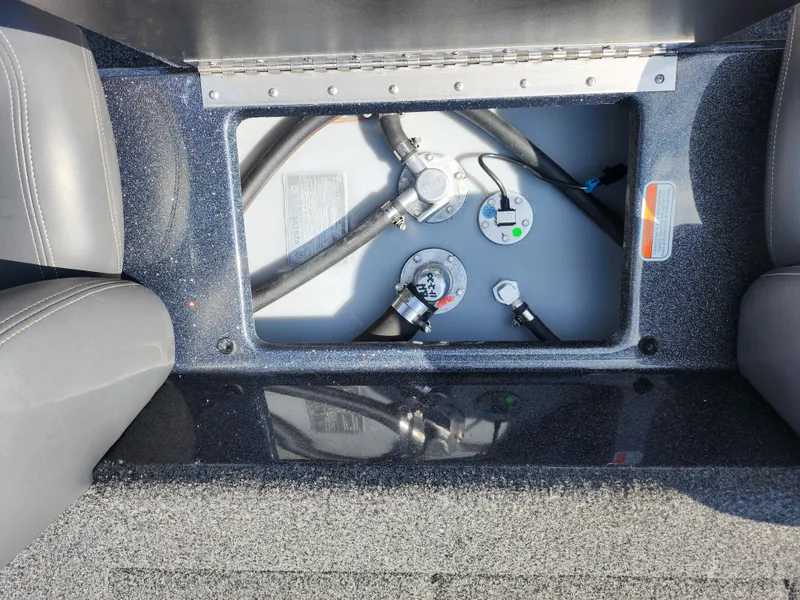 Slide: The Image of 2021 Nitro Z17 boat fuel tank compartment with hoses and gauges. - 20