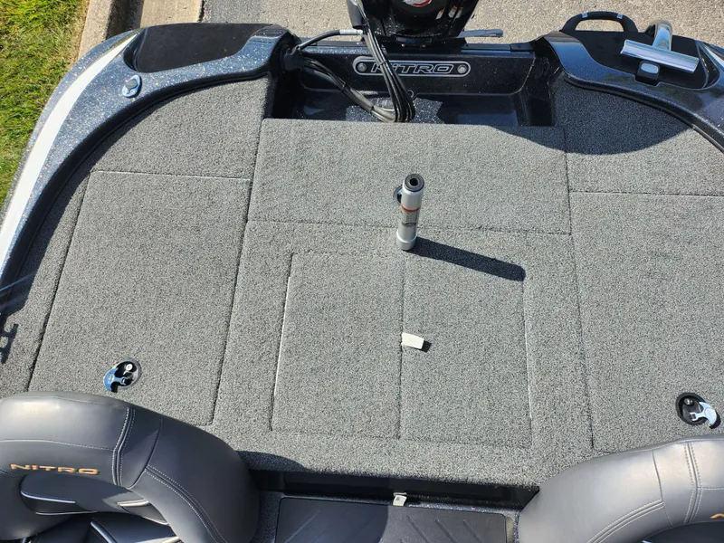 Slide: The Image of 2021 Nitro Z17 boat deck with gray carpet and seating. - 21