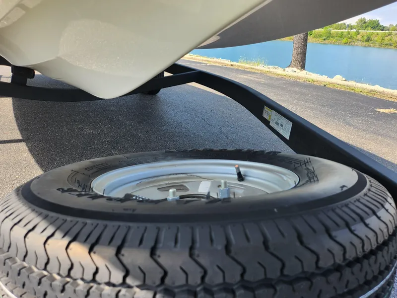 Slide: The Image of Spare tire on Nitro Z17 trailer, 2021 model, near a lake. - 8