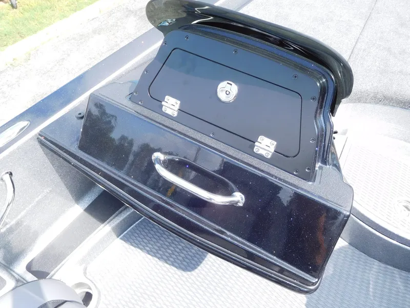 Slide: The Image of 2025 Caymas CX 21 PRO boat storage compartment with sleek black finish and secure lock. - 4