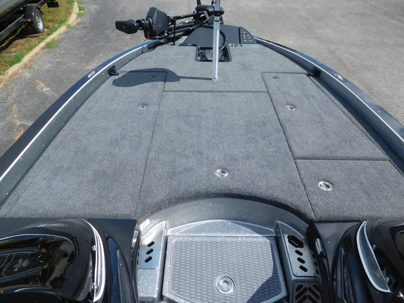 Slide: The Image of 2025 Caymas CX 21 PRO boat deck with carpeted surface and storage compartments. - 5