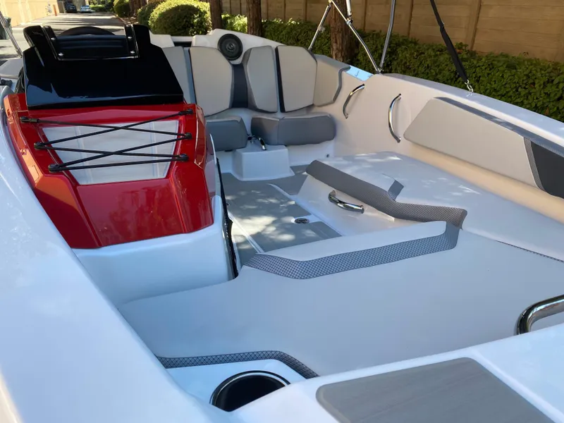 Slide: The Image of 2025 Scarab 165 SE boat interior with modern seating and sleek design. - 3