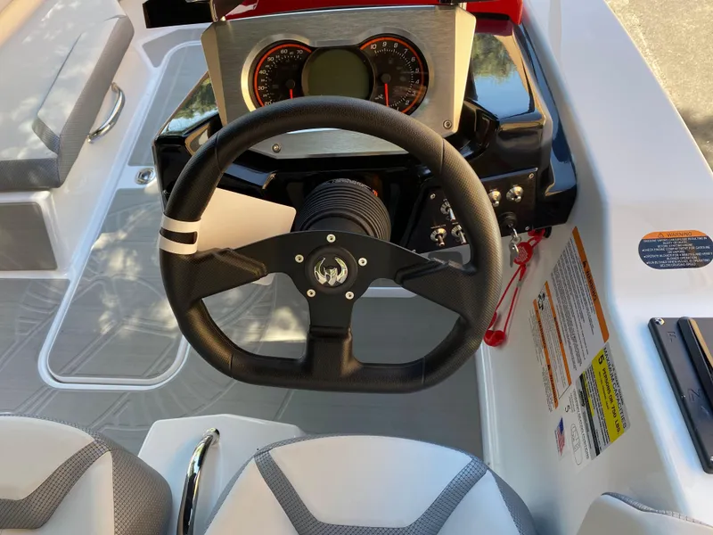 Slide: The Image of 2025 Scarab 165 SE boat dashboard with steering wheel and instrument panel. - 4