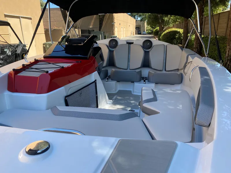 Slide: The Image of 2025 Scarab 165 SE boat interior with modern seating and sleek design. - 9