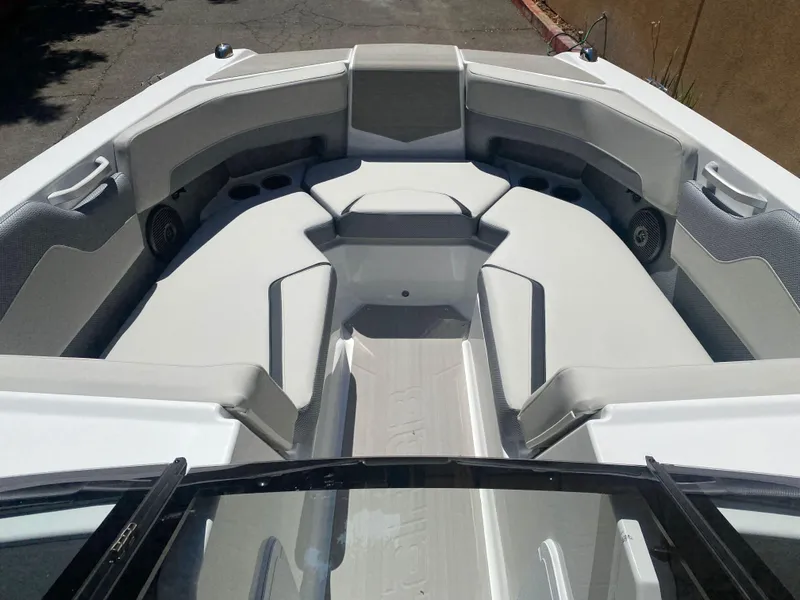 Slide: The Image of 2025 Scarab 235 SE boat interior with spacious seating and modern design. - 12