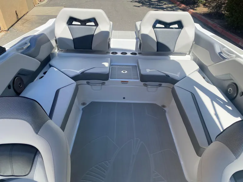 Slide: The Image of 2025 Scarab 235 SE boat interior with modern seating and sleek design. - 16