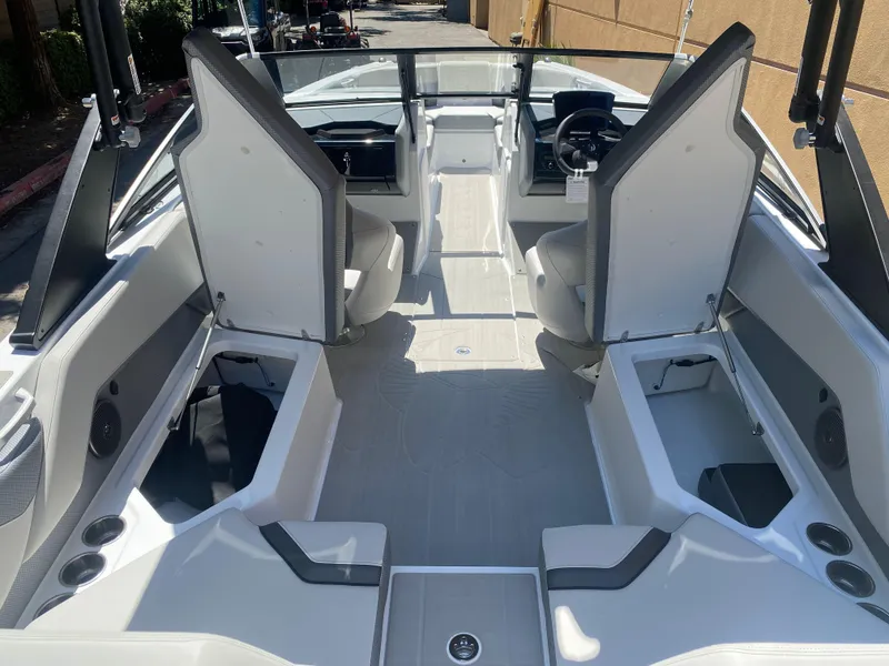 Slide: The Image of 2025 Scarab 235 SE boat interior with modern seating and sleek design. - 20