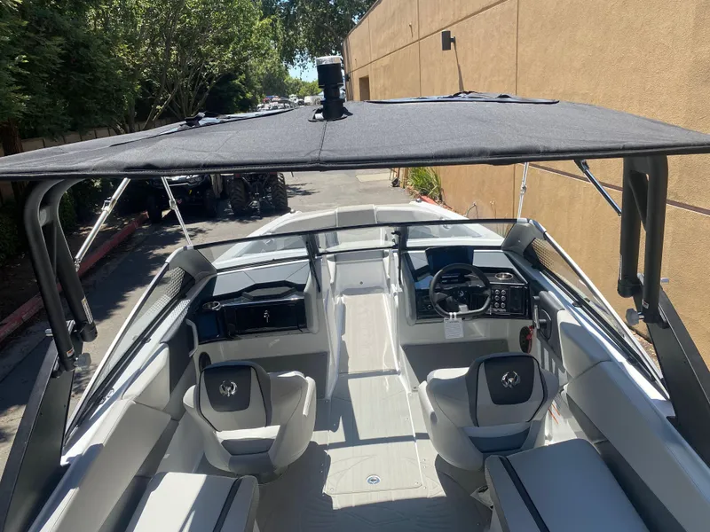 Slide: The Image of 2025 Scarab 235 SE boat interior with sleek seating and modern dashboard. - 23