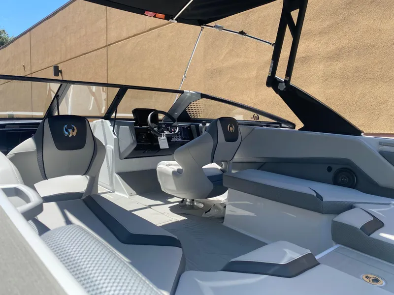 Slide: The Image of 2025 Scarab 235 SE boat interior with modern seating and sleek design. - 5
