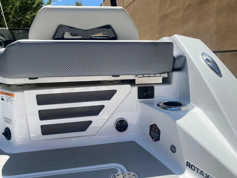 Slide: The Image of 2025 Scarab 235 SE boat interior with seating and control panel. - 8