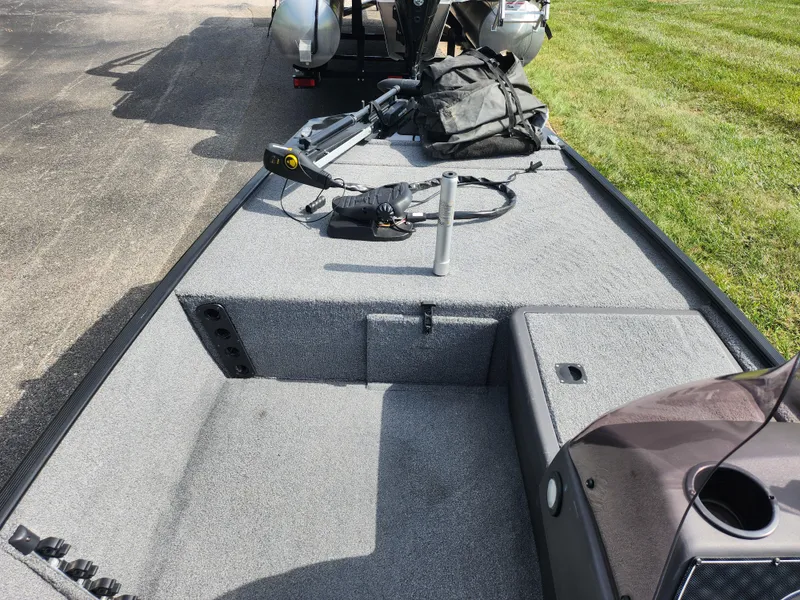 Slide: The Image of 2022 Tracker Bass Tracker Classic XL boat interior with fishing gear on deck. - 14