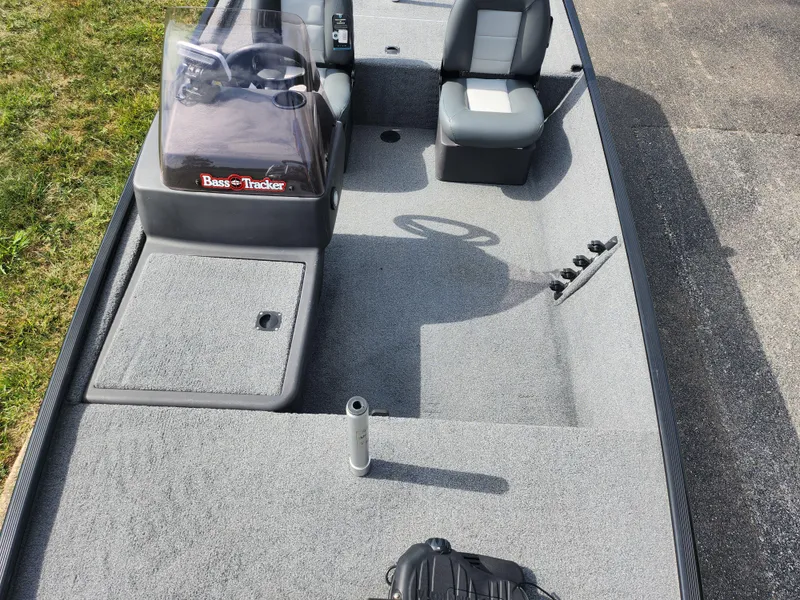 Slide: The Image of 2022 Tracker Bass Tracker Classic XL boat interior with seating and steering console. - 17